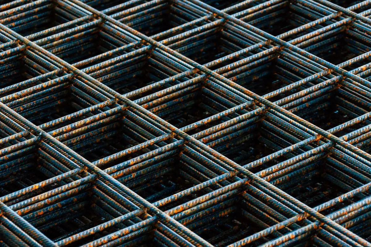 Grid of steel reinforcing bar laid out at a construction site